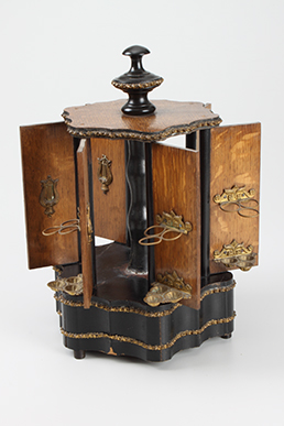 Cigar stand with musical mechanism